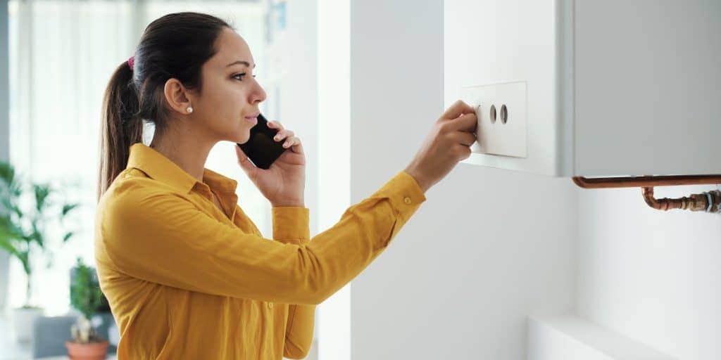 woman-calling-boiler-fault-emergency-min-scaled
